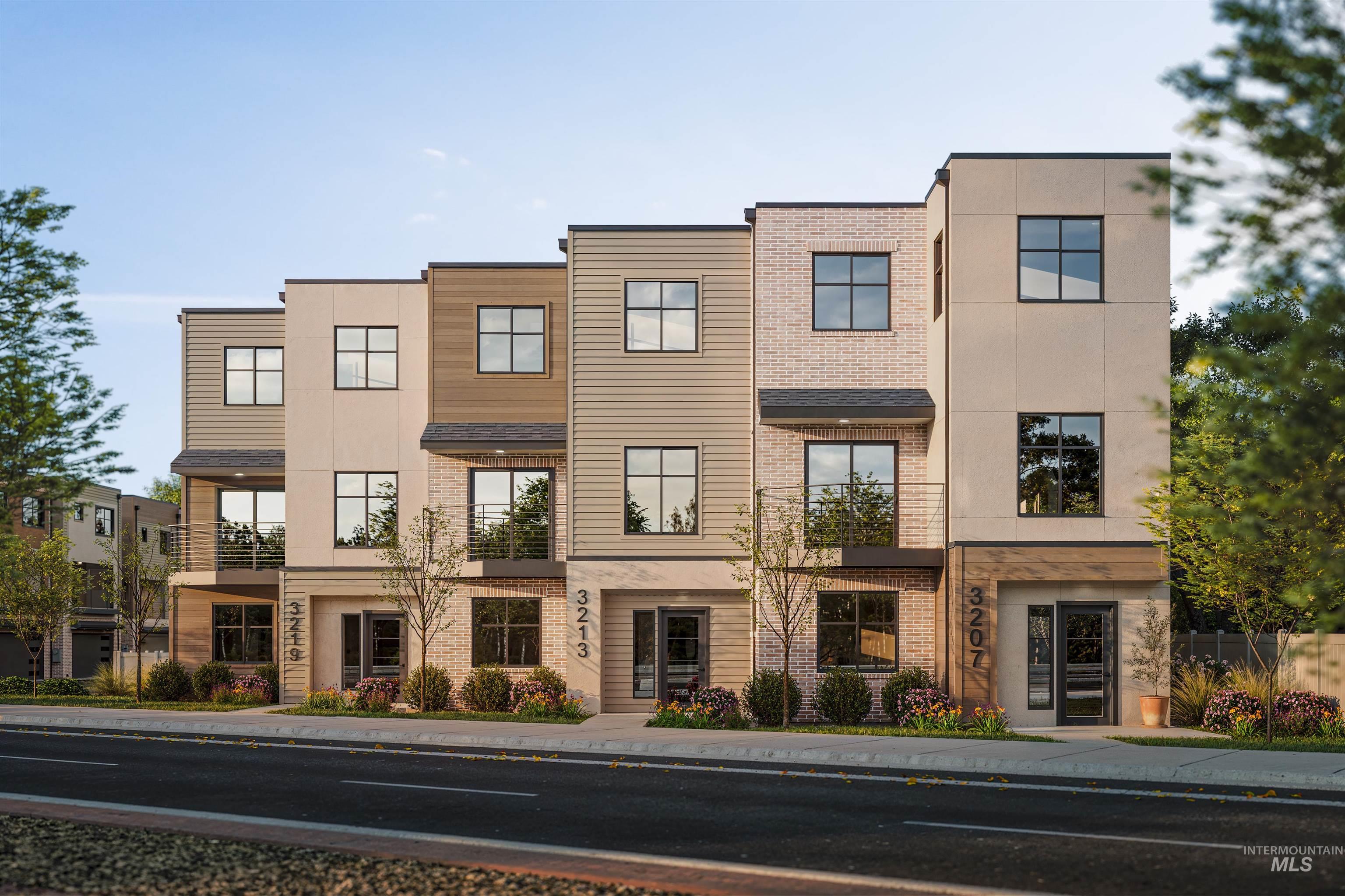 View of front of house with brick siding and stucco siding