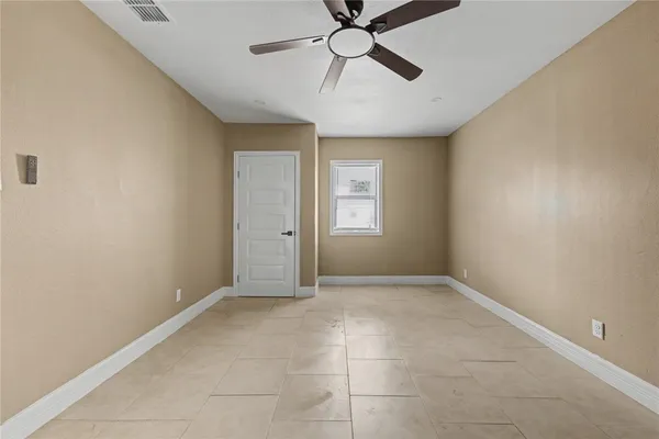 a view of an empty room with a window