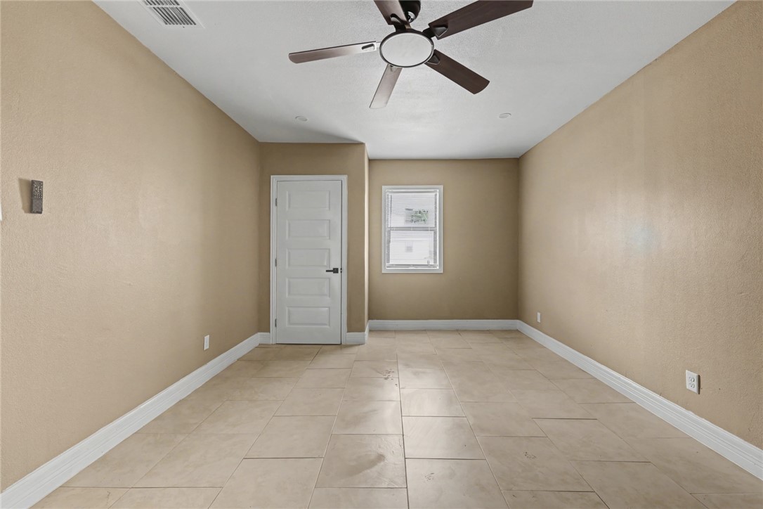 302 Palm Tree Drive Mathis, TX 78368 - Photo 16 of 28 a view of an empty room with a window
