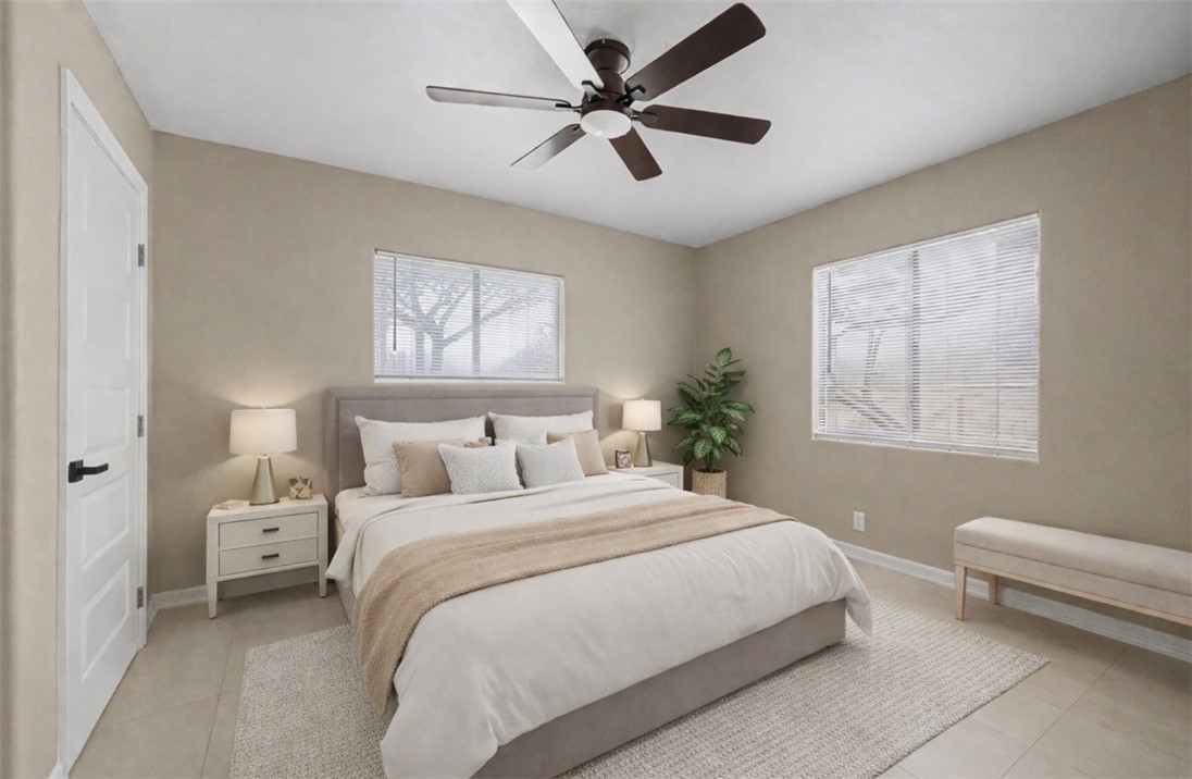 302 Palm Tree Drive Mathis, TX 78368 - Photo 19 of 28 a bedroom with a bed and a couch