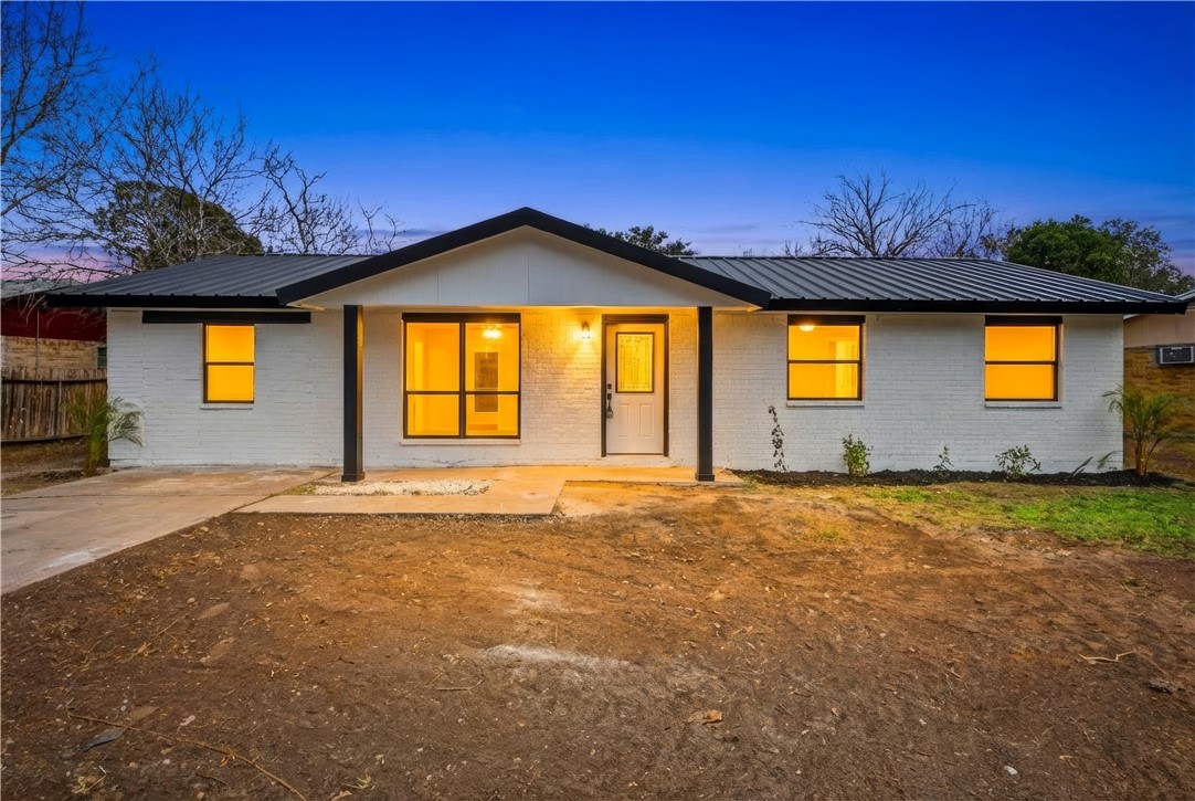 302 Palm Tree Drive Mathis, TX 78368 - Photo 2 of 28 a view of a brick house with a large yard