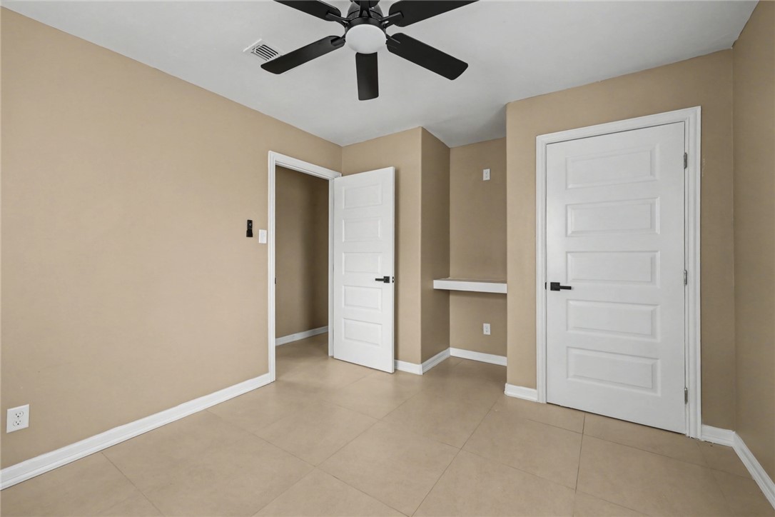 302 Palm Tree Drive Mathis, TX 78368 - Photo 25 of 28 an empty room with closet and ceiling fan