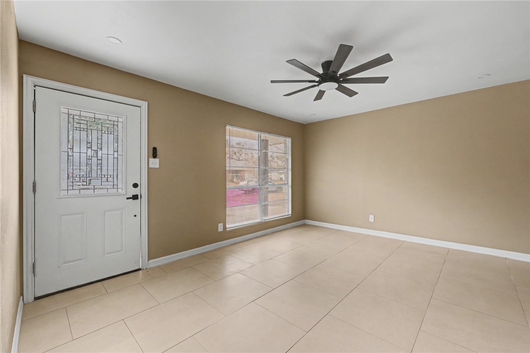 302 Palm Tree Drive Mathis, TX 78368 - Photo 5 of 28 a view of an empty room with a window