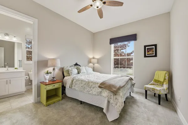 a bedroom with bed and window