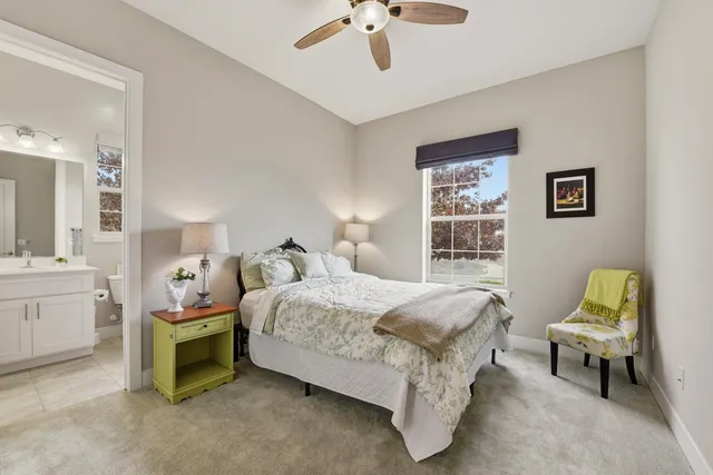 a bedroom with bed and window