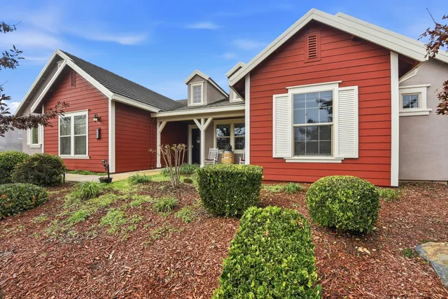 a front view of a house with garden