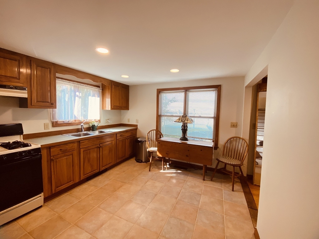 1 Warren Avenue Salisbury, MA 01952 - Photo 11 of 29 a kitchen with a sink and a large window