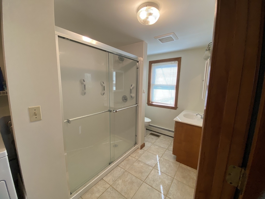 1 Warren Avenue Salisbury, MA 01952 - Photo 16 of 29 a bathroom with a shower and a sink