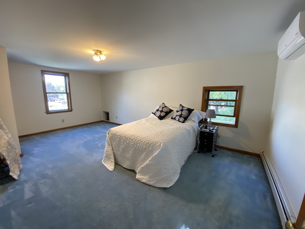 1 Warren Avenue Salisbury, MA 01952 - Photo 23 of 29 a spacious bedroom with a bed and a window