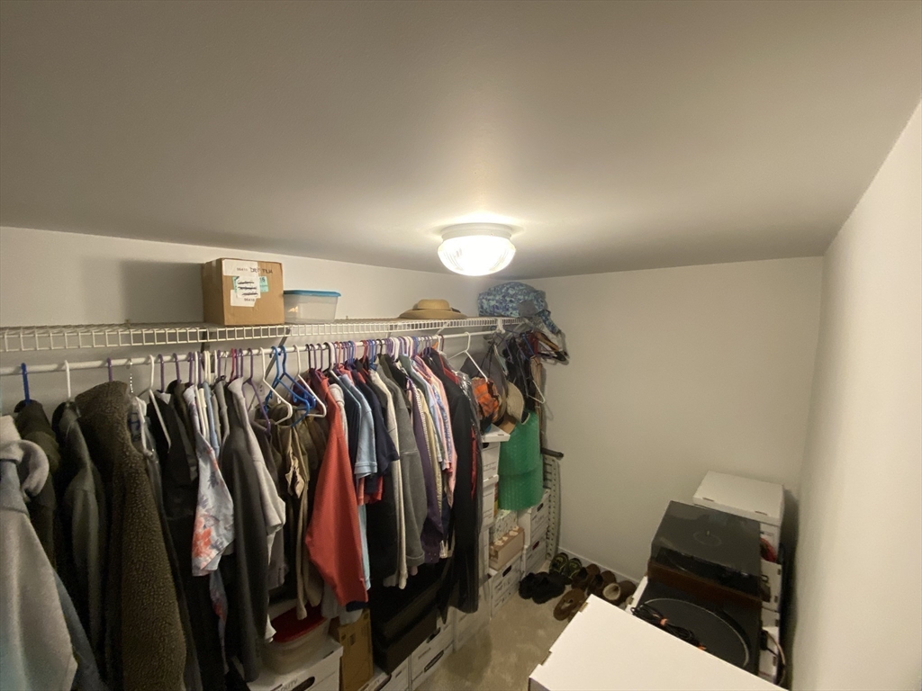 1 Warren Avenue Salisbury, MA 01952 - Photo 25 of 29 a view of walk in closet with clothes and shoes