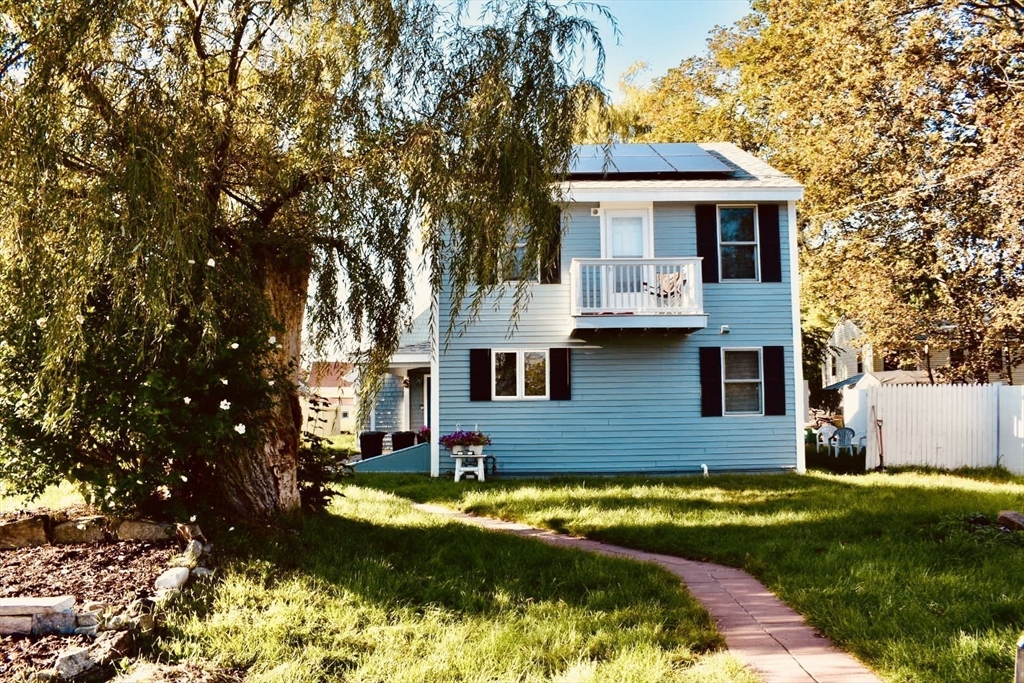1 Warren Avenue Salisbury, MA 01952 - Photo 3 of 29 a front view of a house with yard and garage
