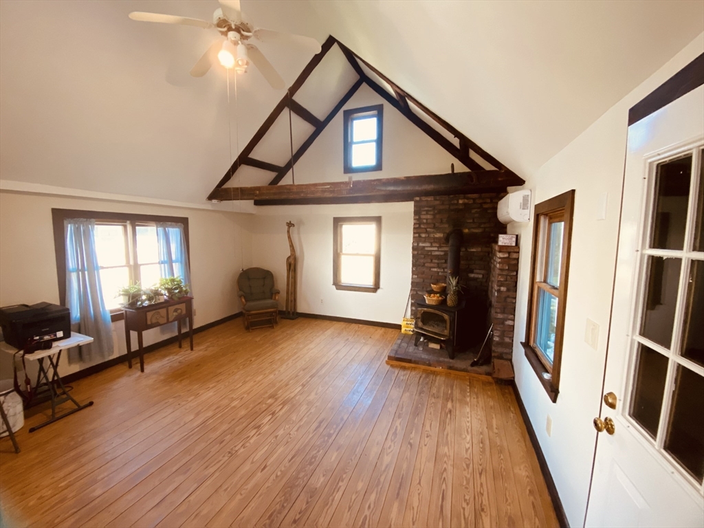 1 Warren Avenue Salisbury, MA 01952 - Photo 8 of 29 a view of a livingroom with hardwood floor and a ceiling fan