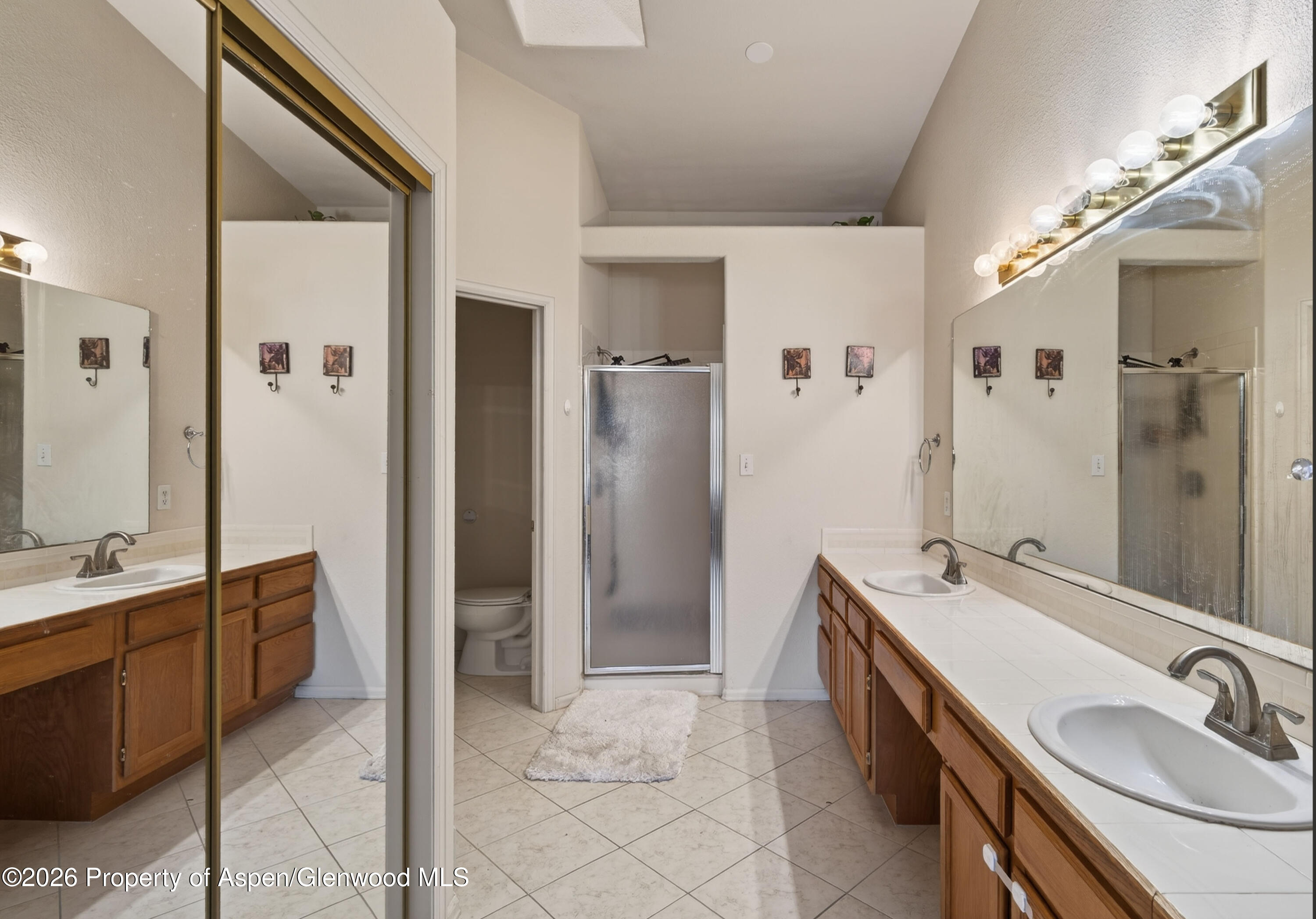 51 North Ridge Court Parachute, CO 81635 - Photo 14 of 28 a bathroom with a tub sink and mirror