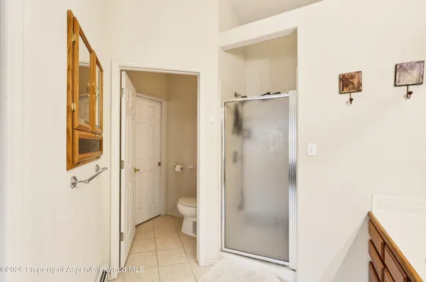 a view of hallway with wooden floor