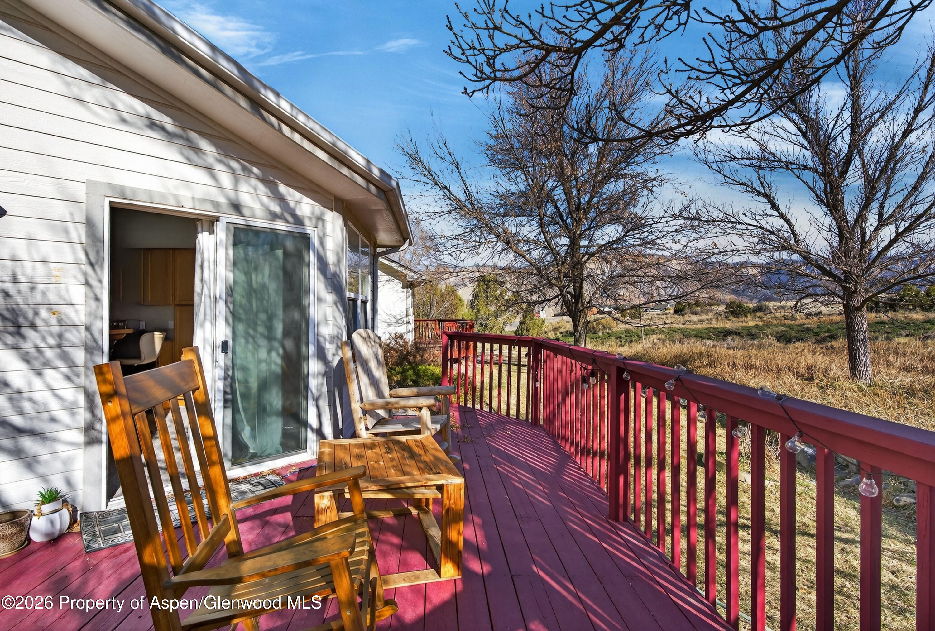 51 North Ridge Court Parachute, CO 81635 - Photo 21 of 28 a balcony with outdoor seating and wooden floor