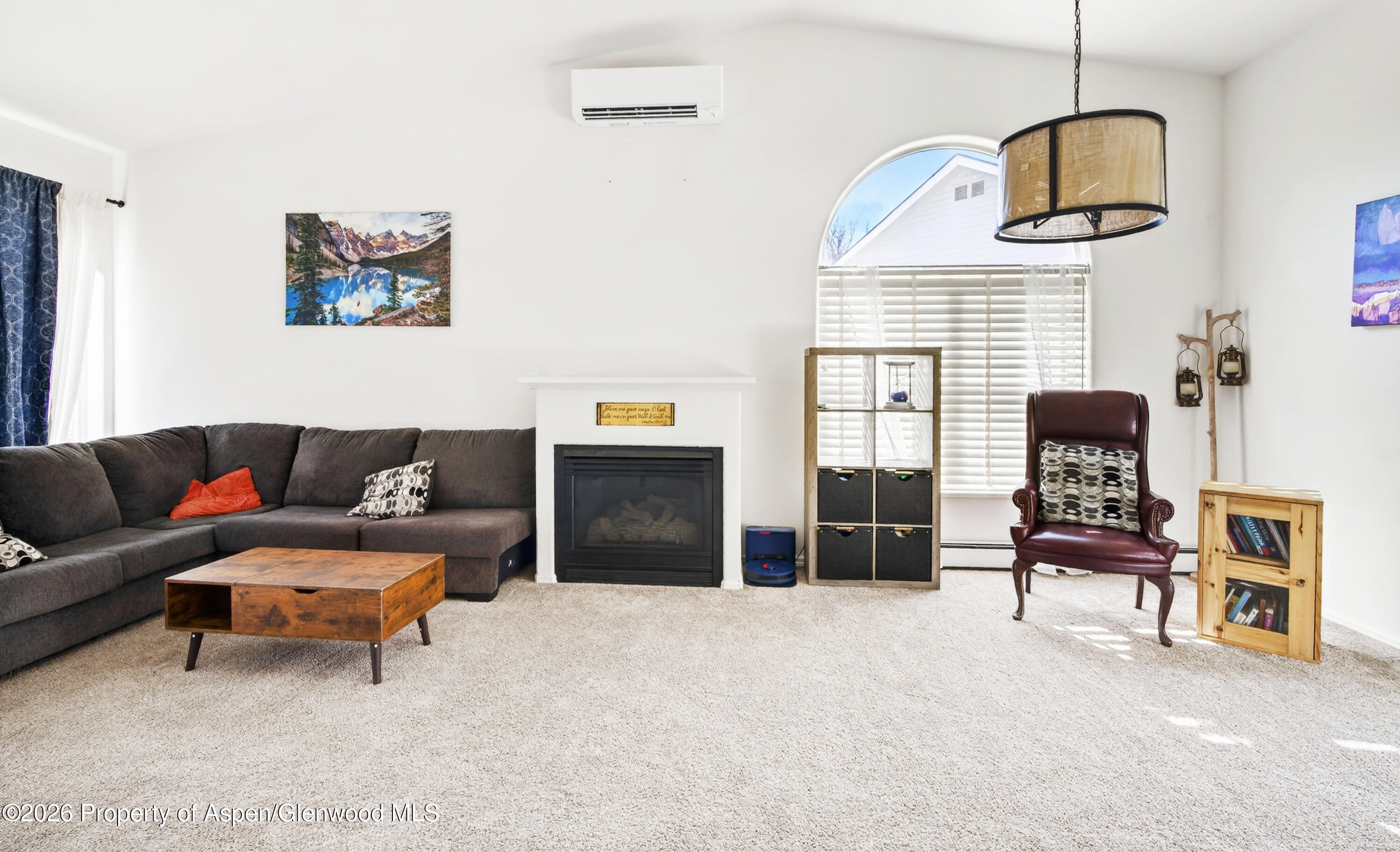 51 North Ridge Court Parachute, CO 81635 - Photo 3 of 28 a living room with furniture and a fireplace