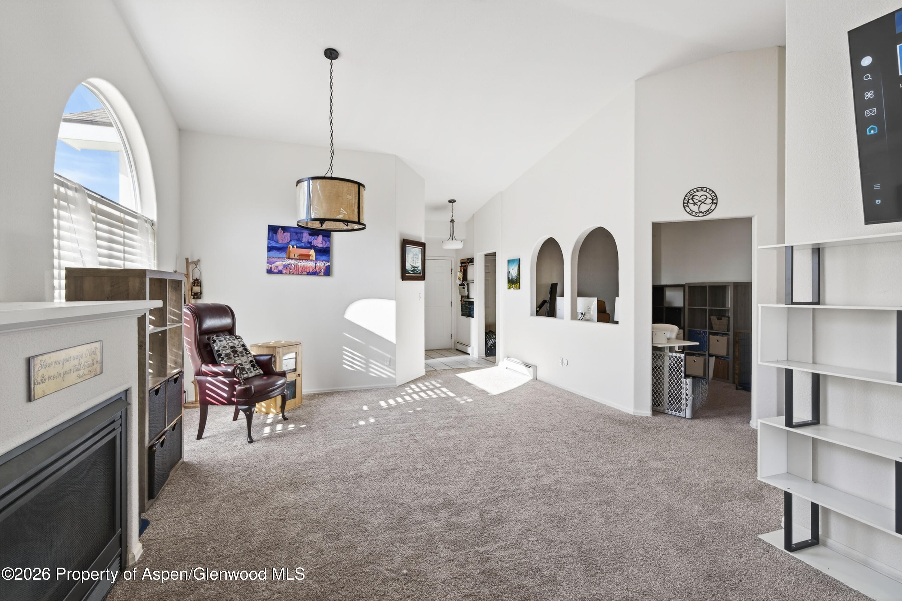 51 North Ridge Court Parachute, CO 81635 - Photo 4 of 28 a living room with furniture a window and kitchen view