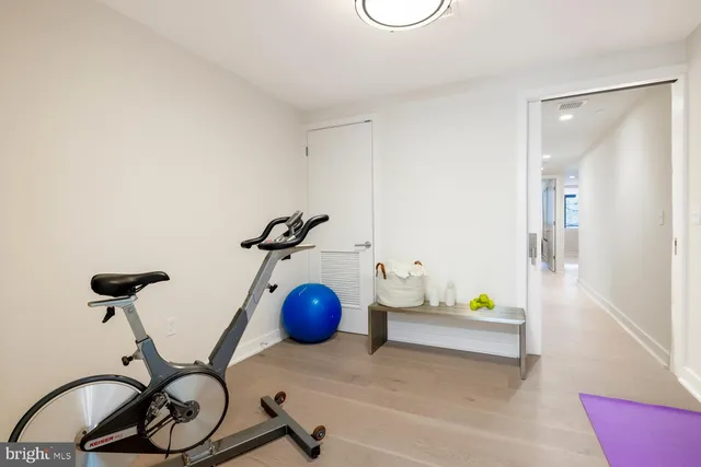 a kitchen with a sink and a refrigerator