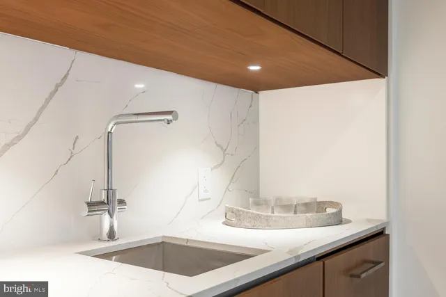 a living room with furniture a couch and a flat screen tv