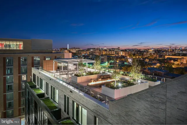 a view of swimming pool with outdoor seating