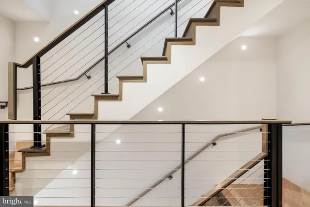 a bedroom with a bed and a night stand