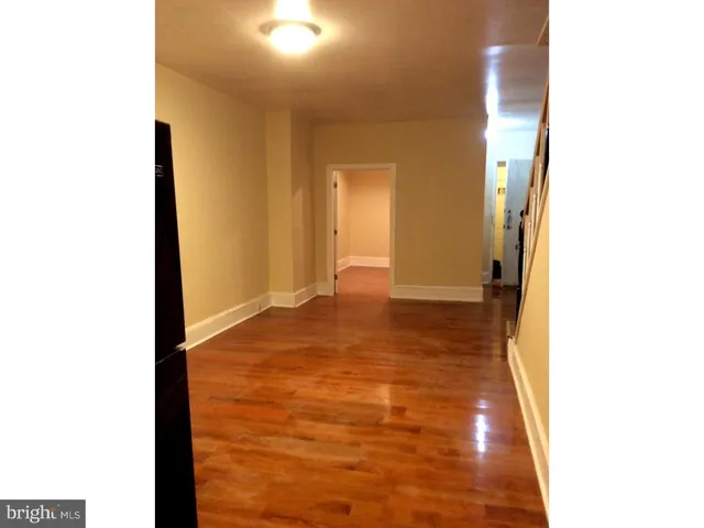 a view of kitchen and wooden floor
