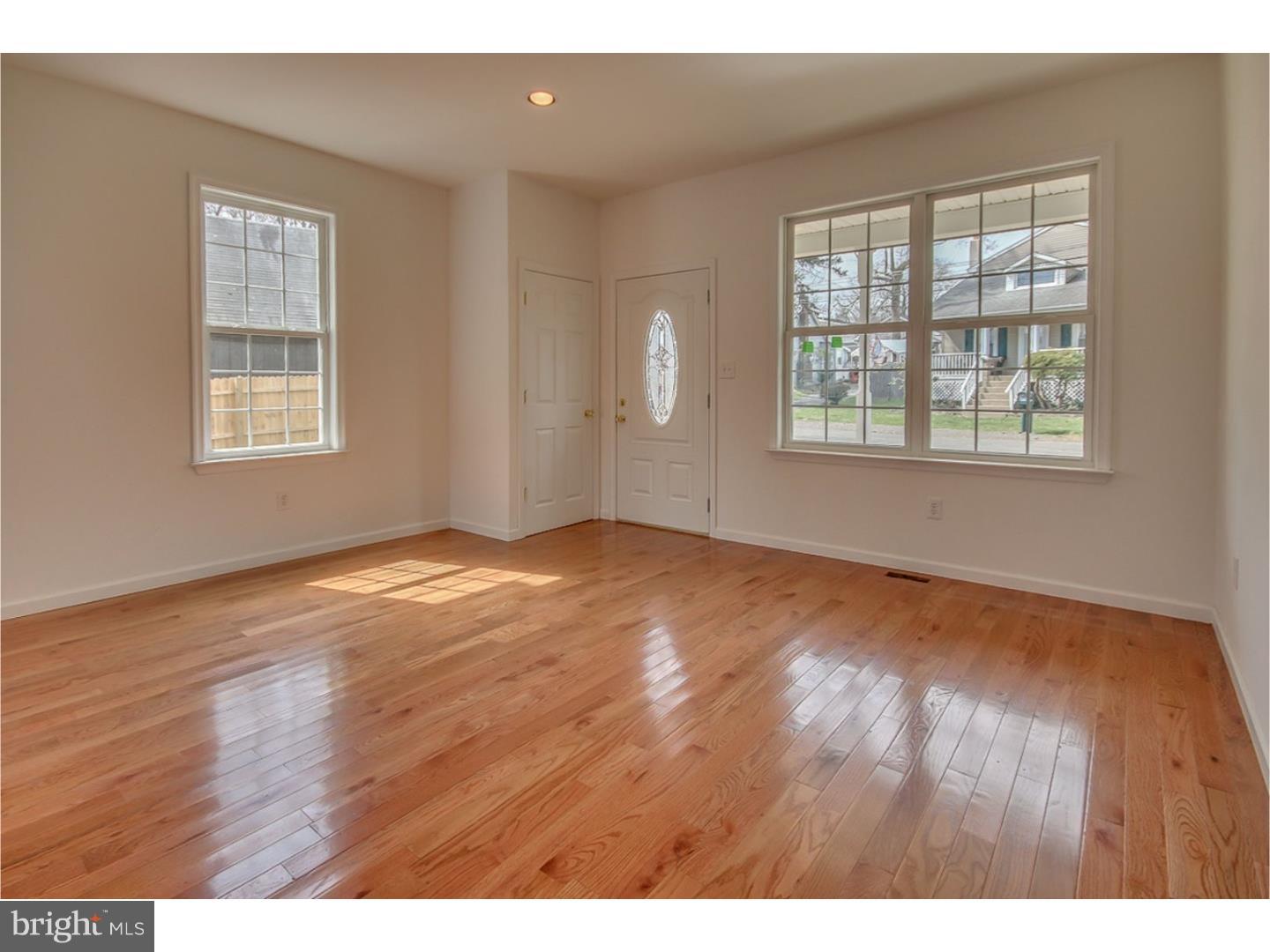 719 North Shedwick Street Philadelphia, PA 19104 - Photo 10 of 24 an empty room with wooden floor and windows
