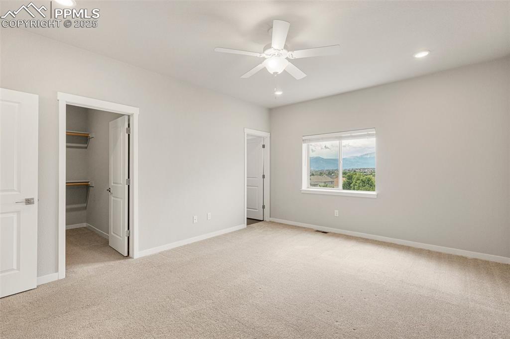 5466 Arden Grove Colorado Springs, CO 80922 - Photo 20 of 35 an empty room with windows and fan
