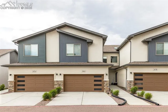 a front view of a house with garage
