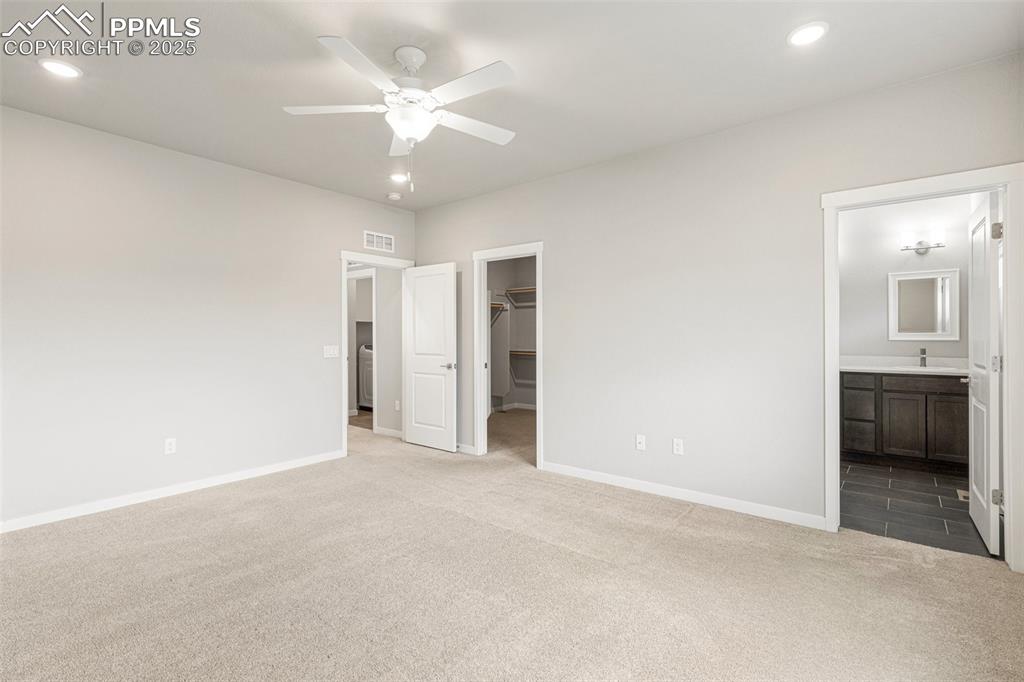 5466 Arden Grove Colorado Springs, CO 80922 - Photo 21 of 35 an empty room with a bathroom and a sink