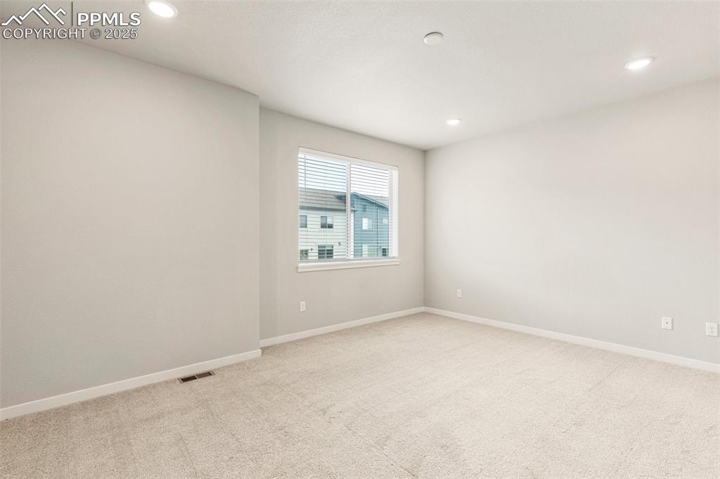 5466 Arden Grove Colorado Springs, CO 80922 - Photo 22 of 35 an empty room with windows