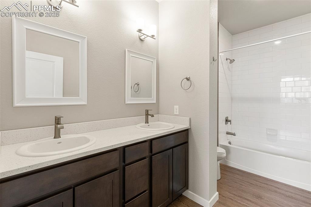 5466 Arden Grove Colorado Springs, CO 80922 - Photo 25 of 35 a bathroom with a sink double vanity granite tub and shower