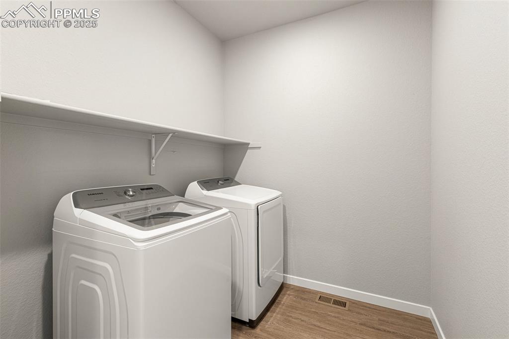 5466 Arden Grove Colorado Springs, CO 80922 - Photo 29 of 35 a utility room with dryer and washer