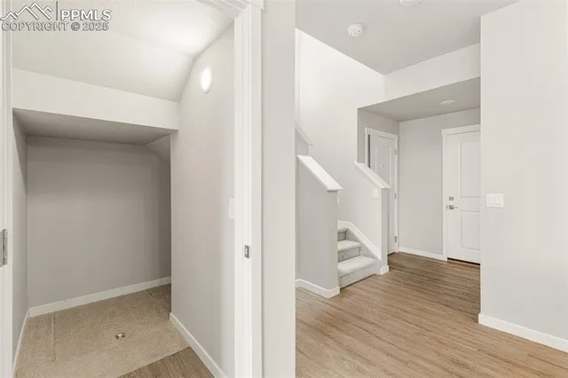a view of a hallway with closet and closet