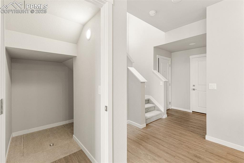 5466 Arden Grove Colorado Springs, CO 80922 - Photo 30 of 35 a view of an entryway with wooden floor