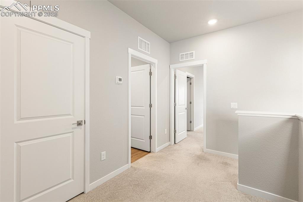 5466 Arden Grove Colorado Springs, CO 80922 - Photo 31 of 35 a view of a hallway with closet and closet