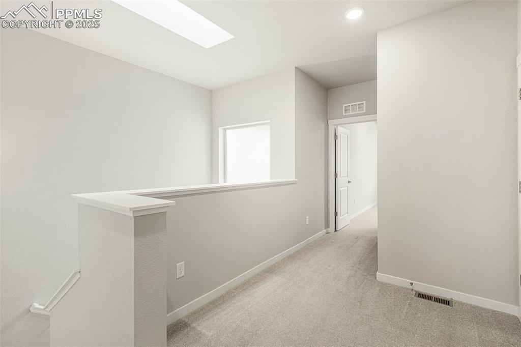 5466 Arden Grove Colorado Springs, CO 80922 - Photo 32 of 35 a view of hallway with window