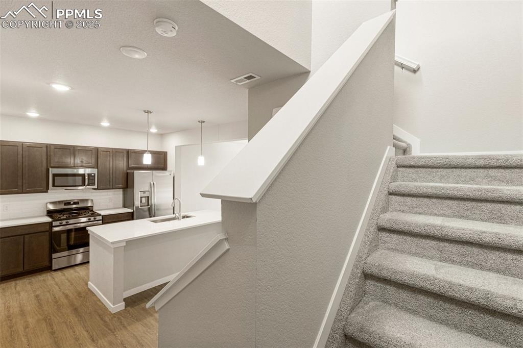 5466 Arden Grove Colorado Springs, CO 80922 - Photo 9 of 35 a view of kitchen with microwave and stove