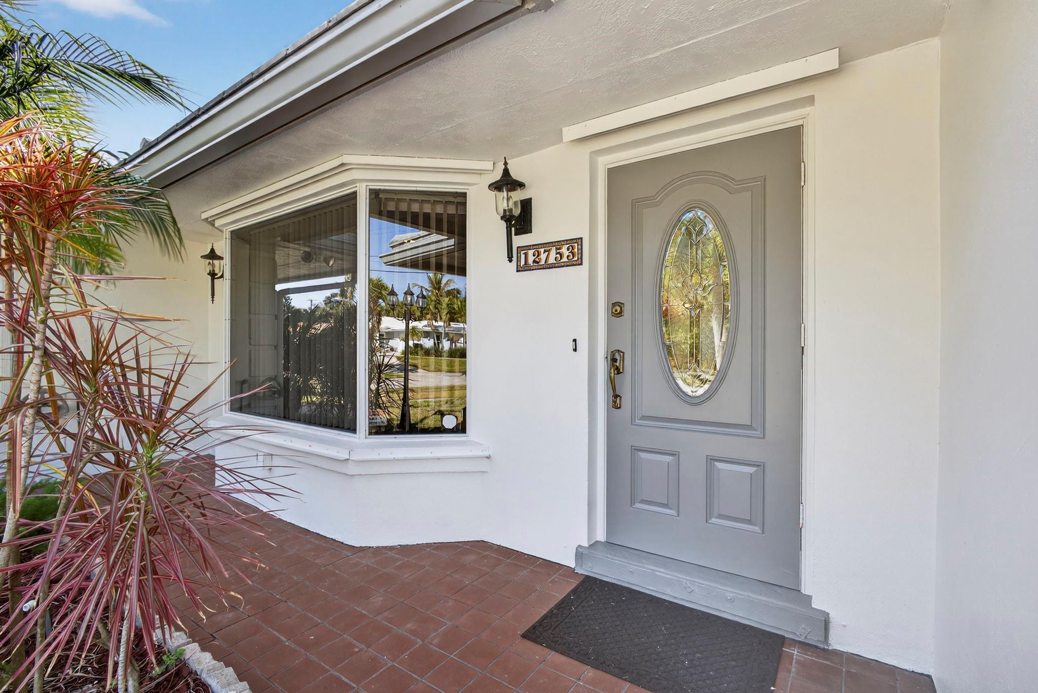 12753 Longford Road North Palm Beach, FL 33408 - Photo 15 of 68 a front view of a house with garden