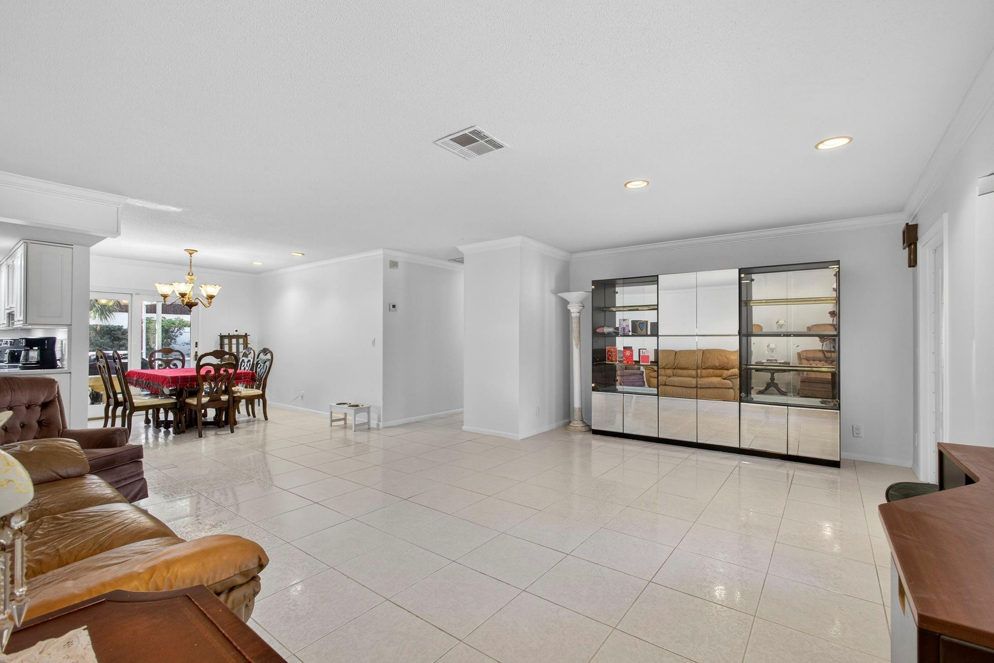 12753 Longford Road North Palm Beach, FL 33408 - Photo 18 of 68 a living room with furniture and large window