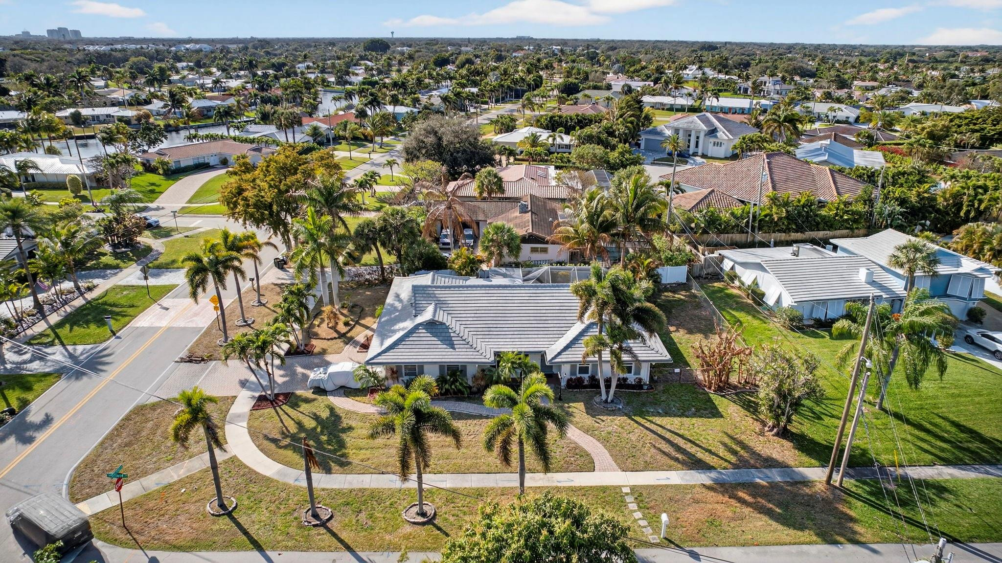 12753 Longford Road North Palm Beach, FL 33408 - Photo 2 of 68 an aerial view of residential houses with outdoor space and trees