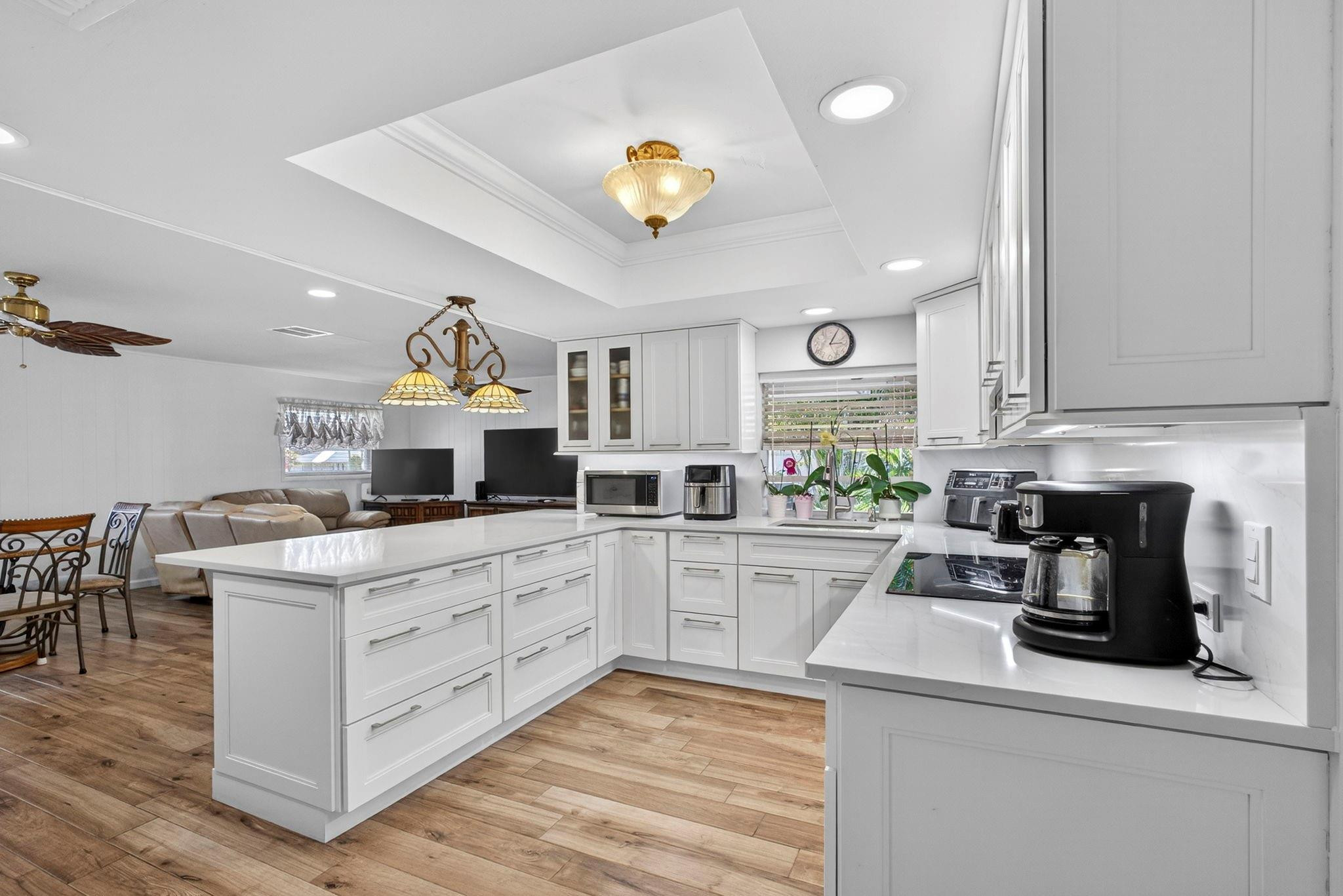 12753 Longford Road North Palm Beach, FL 33408 - Photo 22 of 68 a kitchen with a stove and a refrigerator