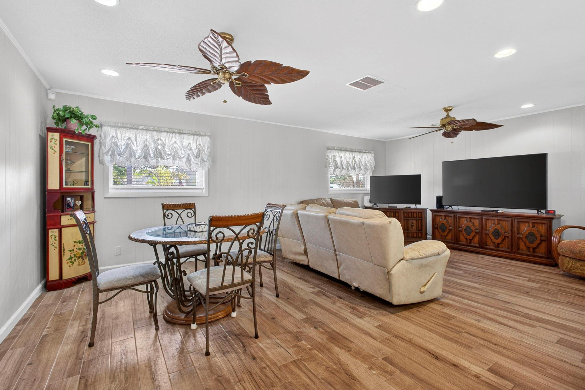 12753 Longford Road North Palm Beach, FL 33408 - Photo 31 of 68 a living room with furniture and a flat screen tv