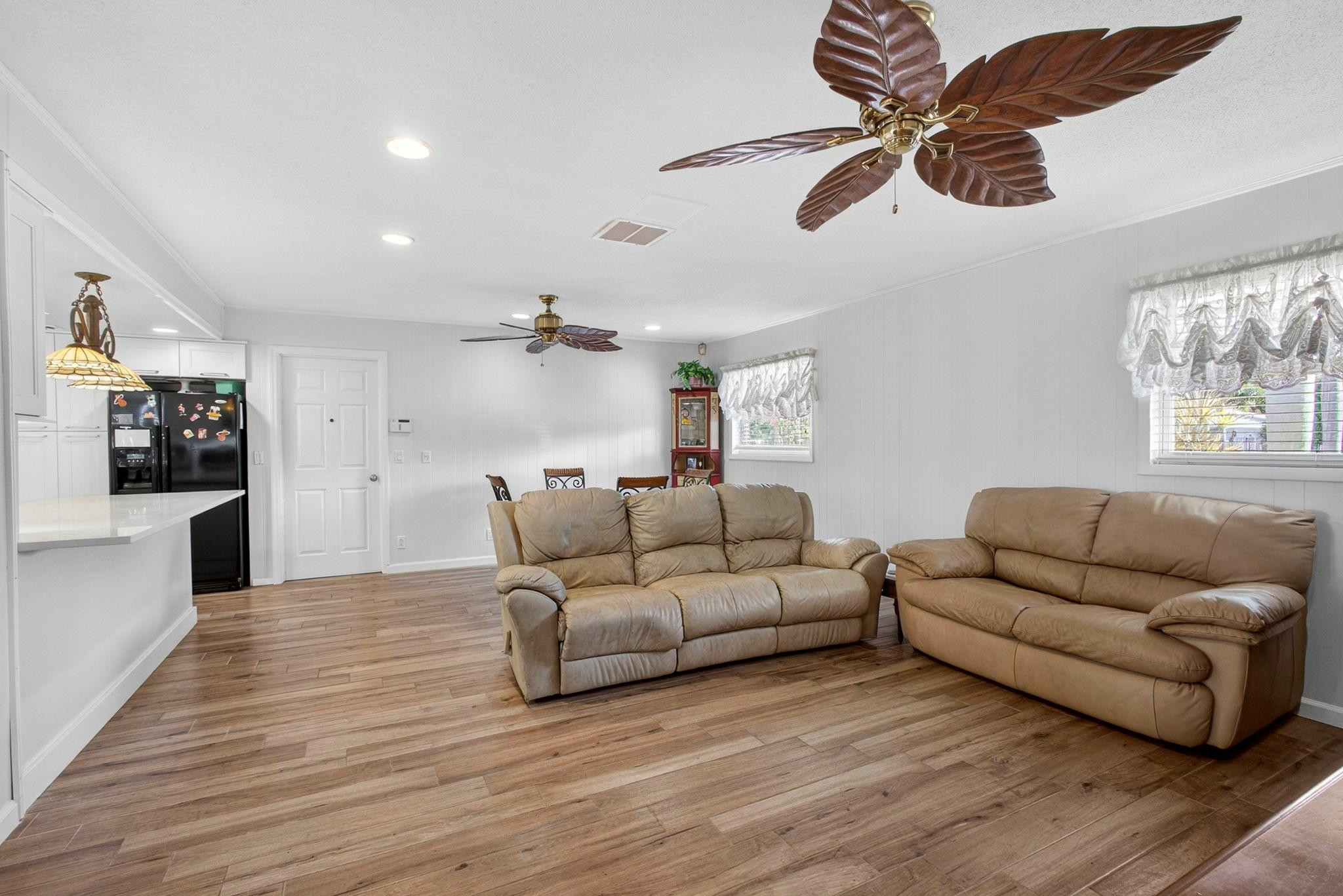12753 Longford Road North Palm Beach, FL 33408 - Photo 32 of 68 a living room with furniture and a wooden floor