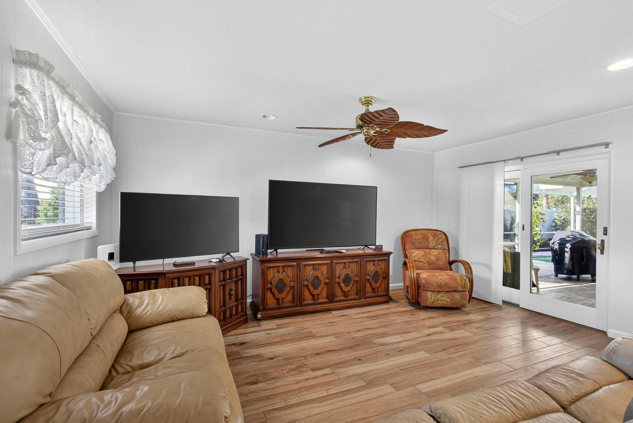 12753 Longford Road North Palm Beach, FL 33408 - Photo 33 of 68 a living room with furniture and a flat screen tv