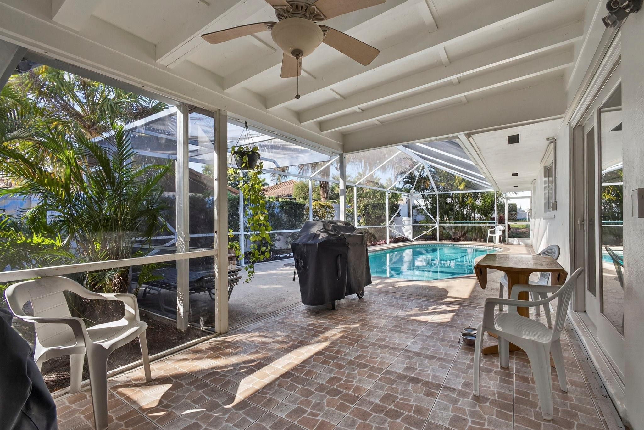 12753 Longford Road North Palm Beach, FL 33408 - Photo 34 of 68 a view of a chairs and table in a patio