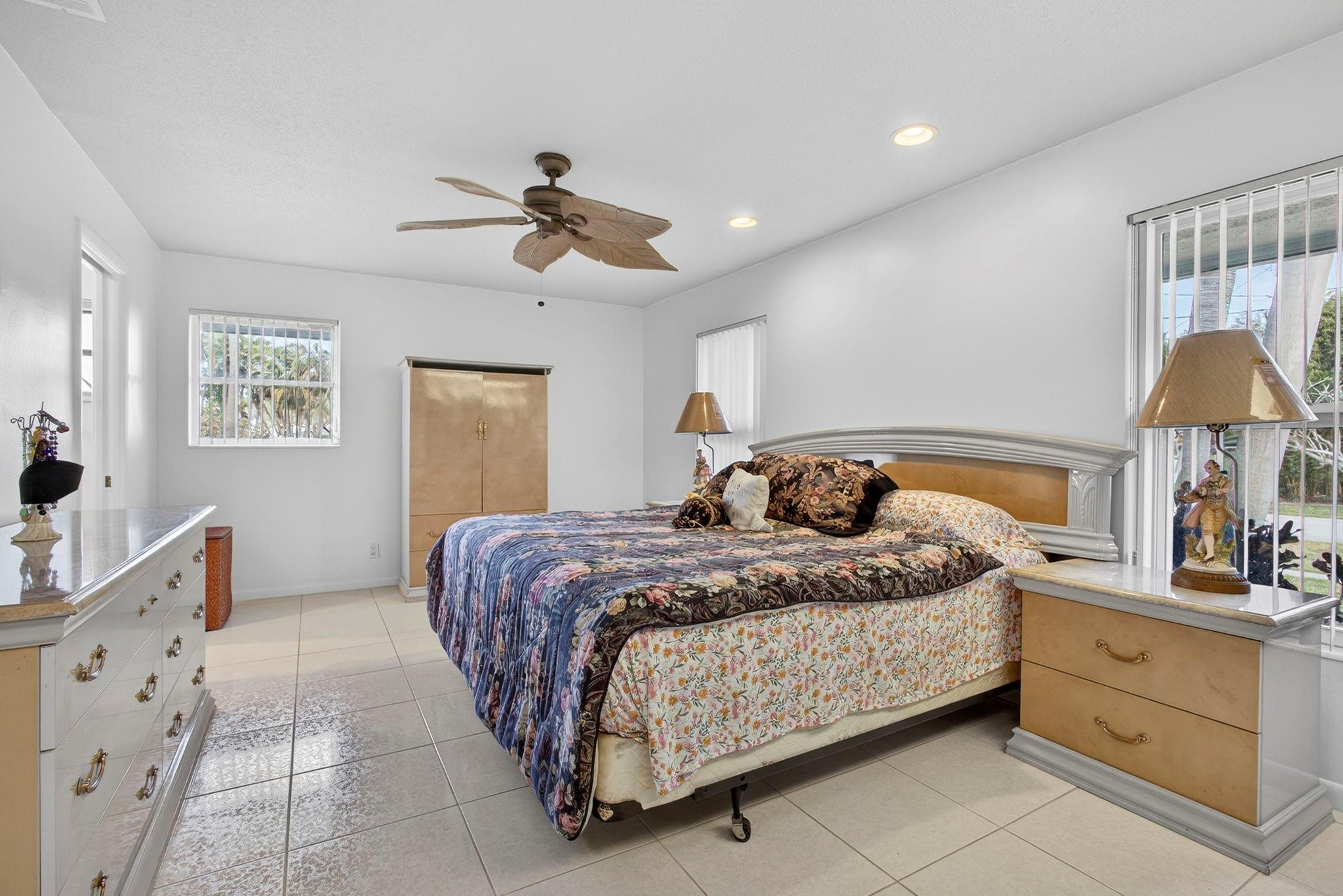 12753 Longford Road North Palm Beach, FL 33408 - Photo 38 of 68 a bedroom with a bed and a dresser