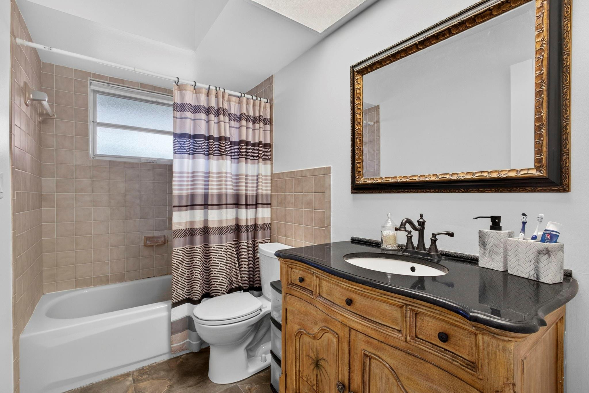 12753 Longford Road North Palm Beach, FL 33408 - Photo 43 of 68 a bathroom with a sink a toilet and shower