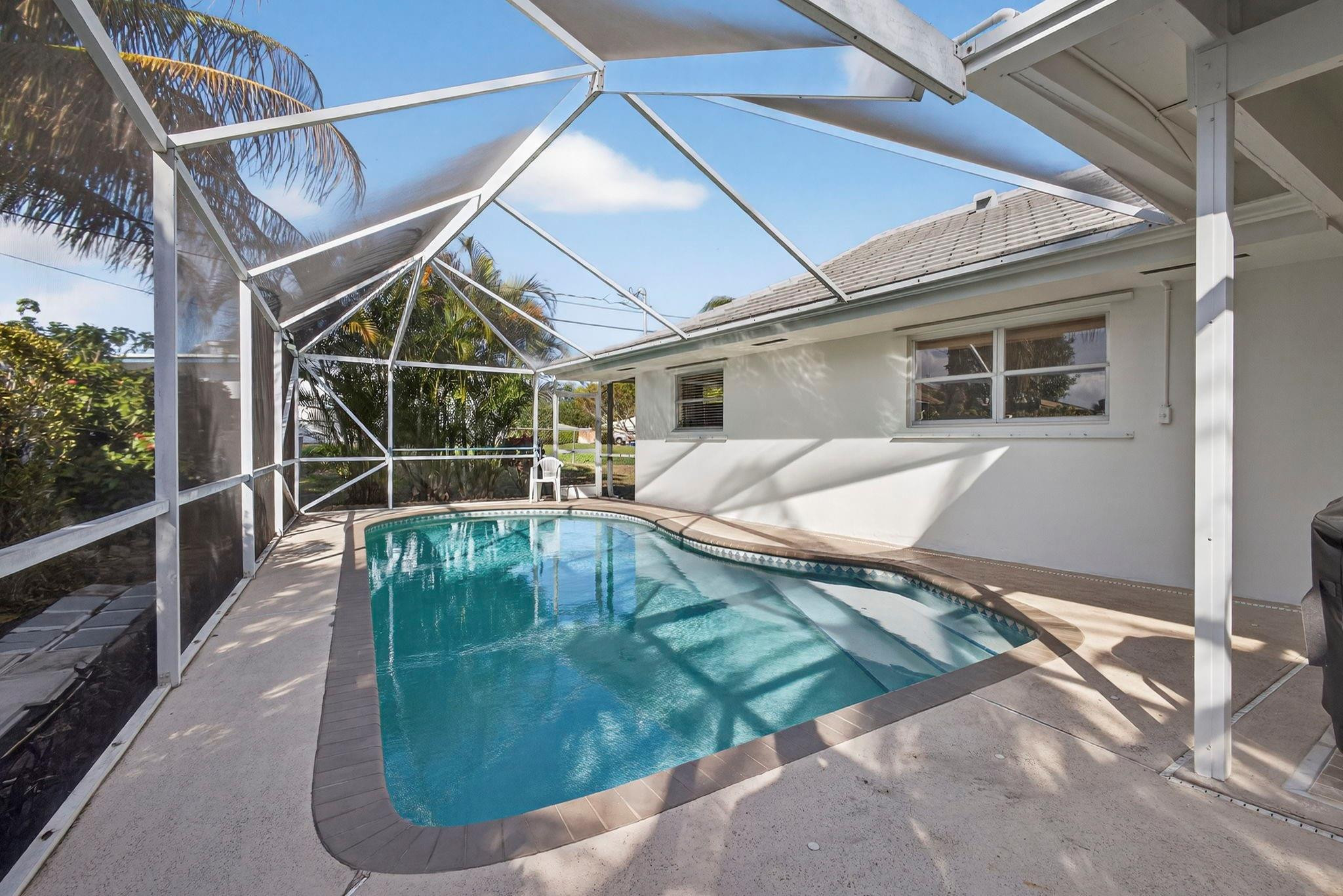 12753 Longford Road North Palm Beach, FL 33408 - Photo 49 of 68 a view of a back yard of the house
