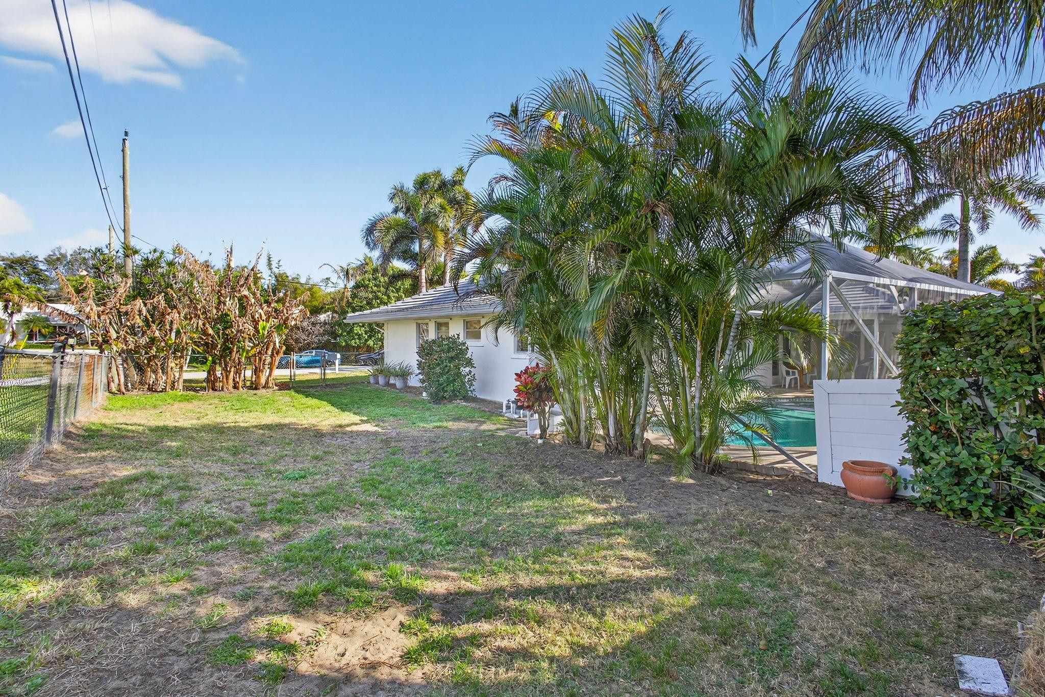 12753 Longford Road North Palm Beach, FL 33408 - Photo 52 of 68 a view of a house with a yard and tree s